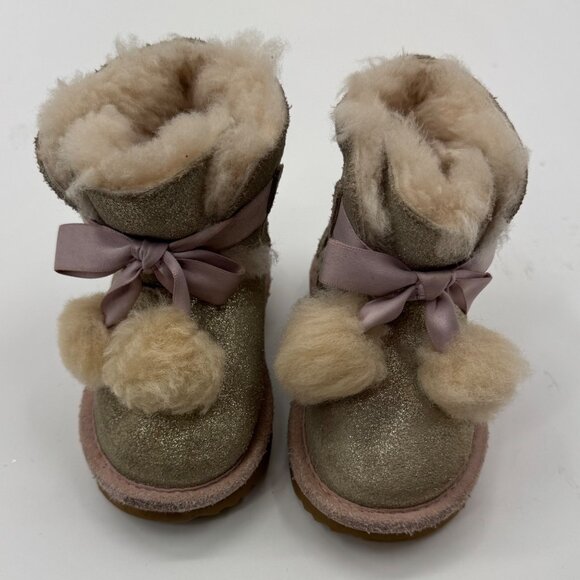 UGG Infant Girls Metallic Gold Sheepskin Bow Booties With Pom-Poms - Picture 2 of 11